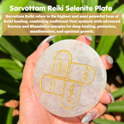 Hand holding a Sarvottam Reiki Selenite Plate with engraved symbols against a green leafy background.